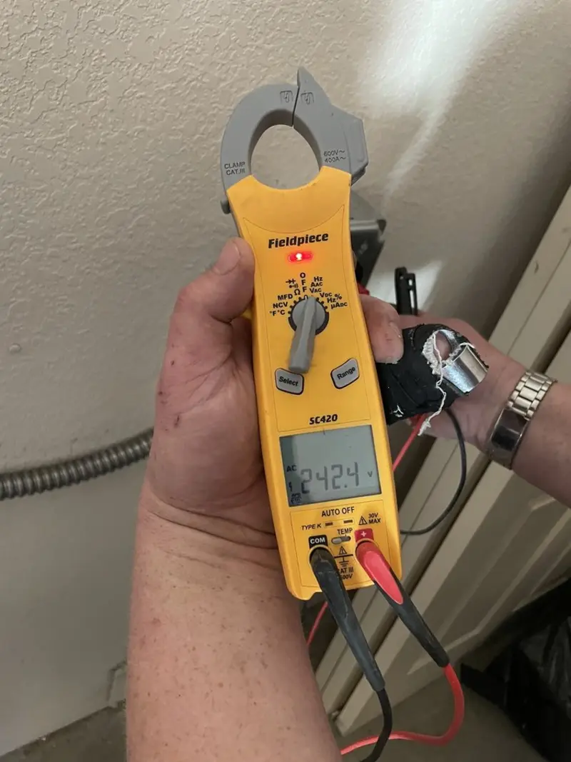 Voltage testing with clamp meter during Generator Installation in Adams